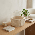 English: Handwoven Rattan Flower Basket with Pearl Handle & Sheer Ribbon Bow, Wicker Floral Arrangement Basket for Wedding, Home Decor & Gift